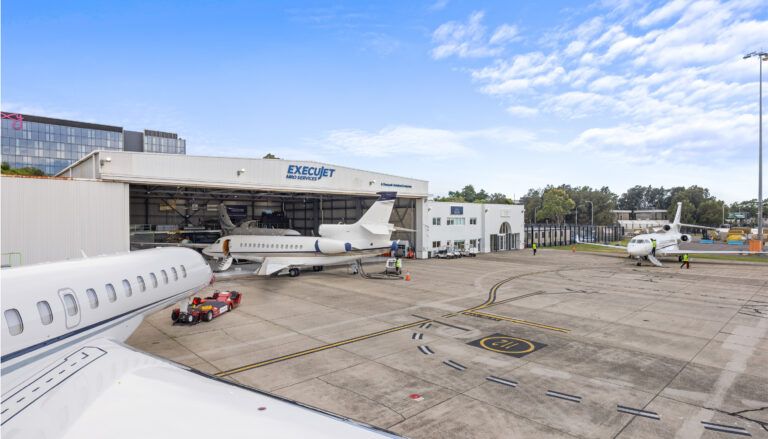ExecuJet MRO Services Australasia marks 25 years Hangar facility with multiple business jets on tarmac