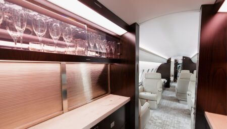Business jet galley with illuminated glassware storage