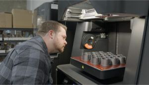 Niel Gunnarson inspecting 3D-printed LED retrofit parts