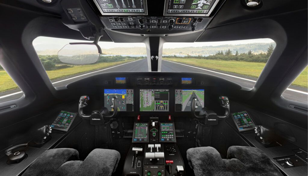 Cockpit with digital displays overlooking runway
