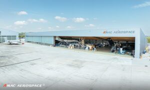 AMAC Aerospace hangar with aircraft visible inside open doors