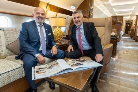 Kadri Muhiddin and Chadi Saade seated in a luxury private jet cabin