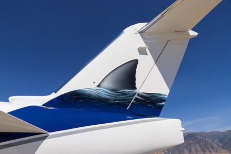 Duncan Aviation delivers shark-inspired jet design Aircraft tail fin with shark emerging from water design