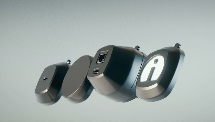 Four sleek black charging ports with USB and power outlets mounted on aircraft wall