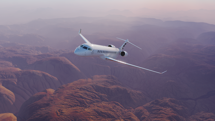 Bombardier Global 8000 awarded Transport Canada Type Certification White private jet flying over dramatic desert canyon landscape at dusk with purple and pink sky