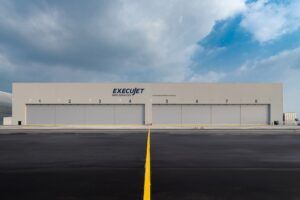 ExecuJet hangar facility with eight numbered bay doors
