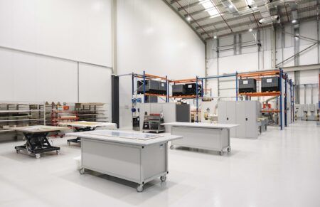 Expansion at F/List’s new Dubai facility Clean modern production facility with workbenches and storage racks