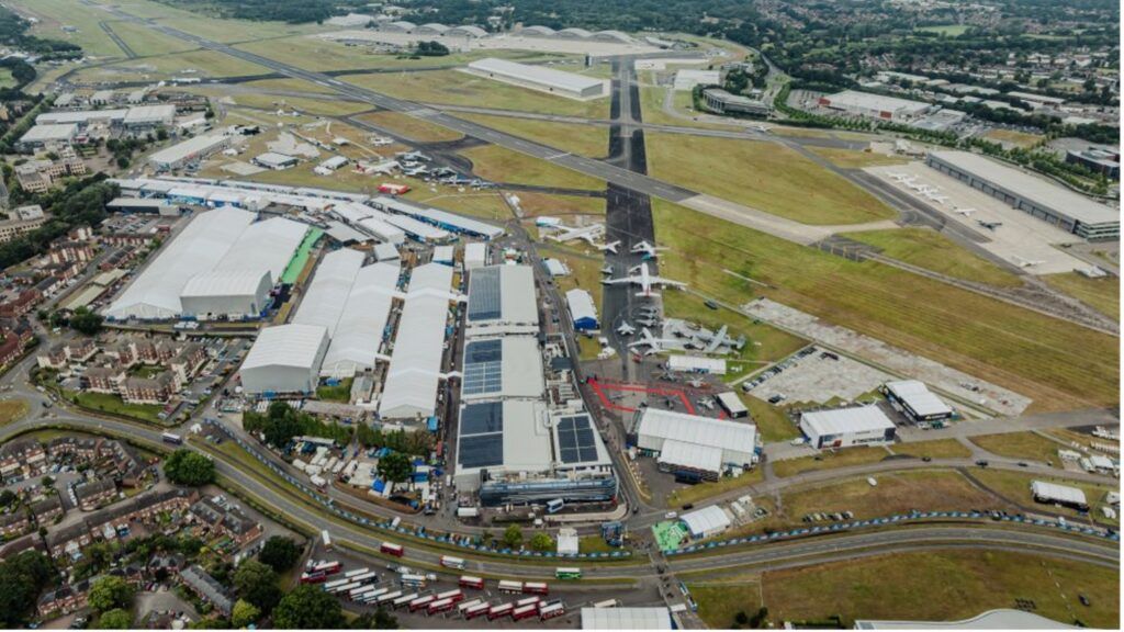 Aerial view of Farnborough International Exhibition and Conference Centre showing exhibition halls, runway, and surrounding infrastructure