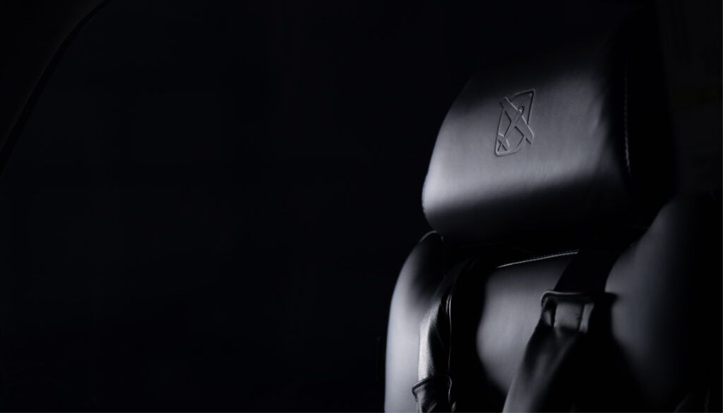 Dark seat with embossed logo
