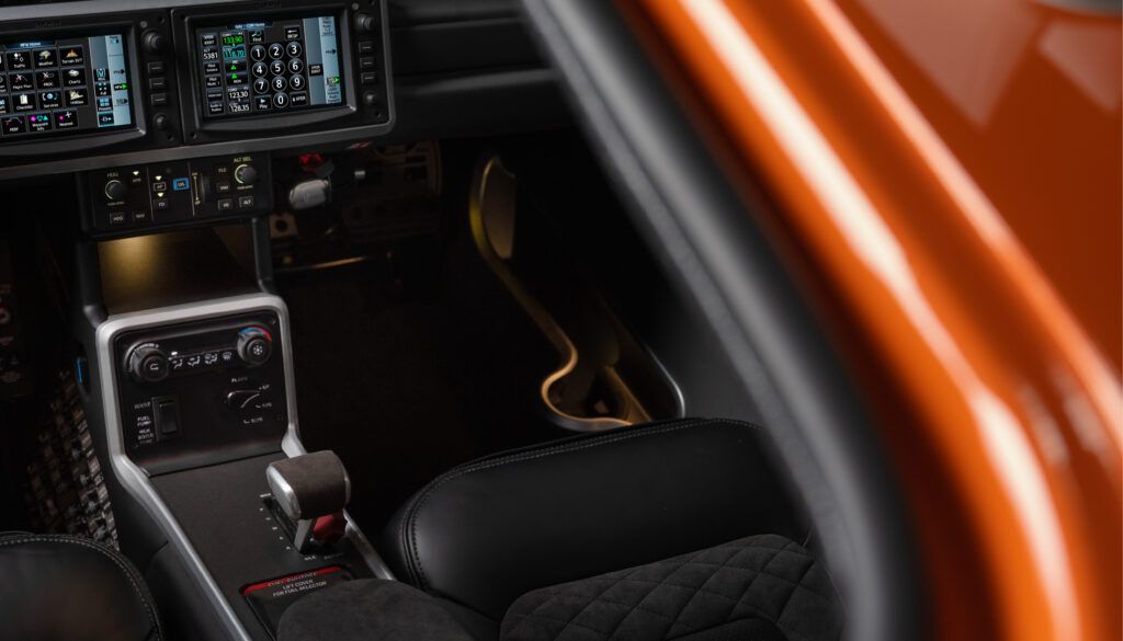 Aircraft cockpit showing flight instruments and leather seats