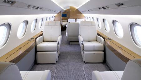 Nautical inspiration for Falcon 900EX revamp Falcon 900EX cabin with modern off-white seats, blonde-tone veneer and navy blue accents