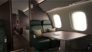 Private jet interior with green leather seats and table