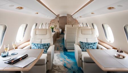 Global 6000 cabin with cream leather seats and blue and cream carpet