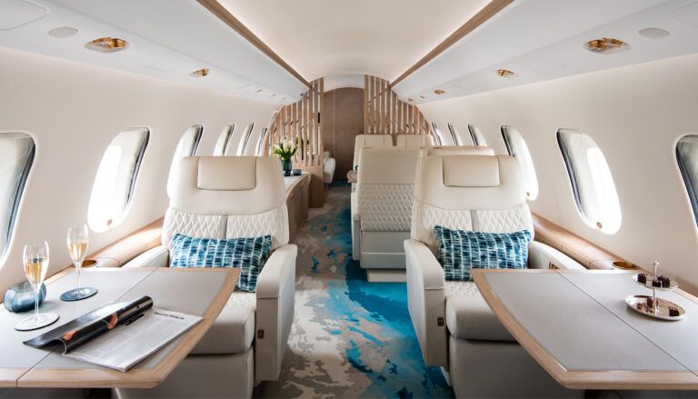 Global 6000 cabin with cream leather seats and blue and cream carpet