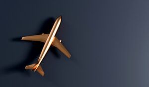 3D rendering of gold aircraft against a dark background.