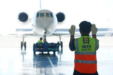 Business jet being guided into ExecuJet Haite’s facility at Beijing Daxing International Airport.