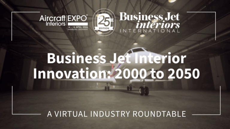 Thumbnail graphic for a virtual industry roundtable titled 'Business Jet Interior Innovation: 2000 to 2050', hosted by Business Jet Interiors International in partnership with Aircraft Interiors Expo 25th Edition, held 14-16 April 2026 in Hamburg, Germany. The background shows a business jet parked inside a large aircraft hangar, with moody, low-contrast lighting. Text and logos appear in white against the darkened image.