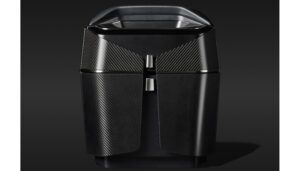 Dark, angular cabinet unit with a carbon fibre weave surface finish and satin black varnish corpus, designed for the Airbus ACH140 helicopter cabin interior.