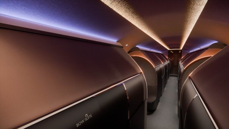 Rendering of The Bow VIP cabin interior showing a row of closed private Bow Suites with warm copper-toned mood lighting and a central aisle.