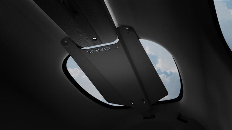View up to cabin ceiling of Cirrus SR Series aircraft, showing the FLEX SR Mount for Starlink installed overhead, with a view of sky through skylight