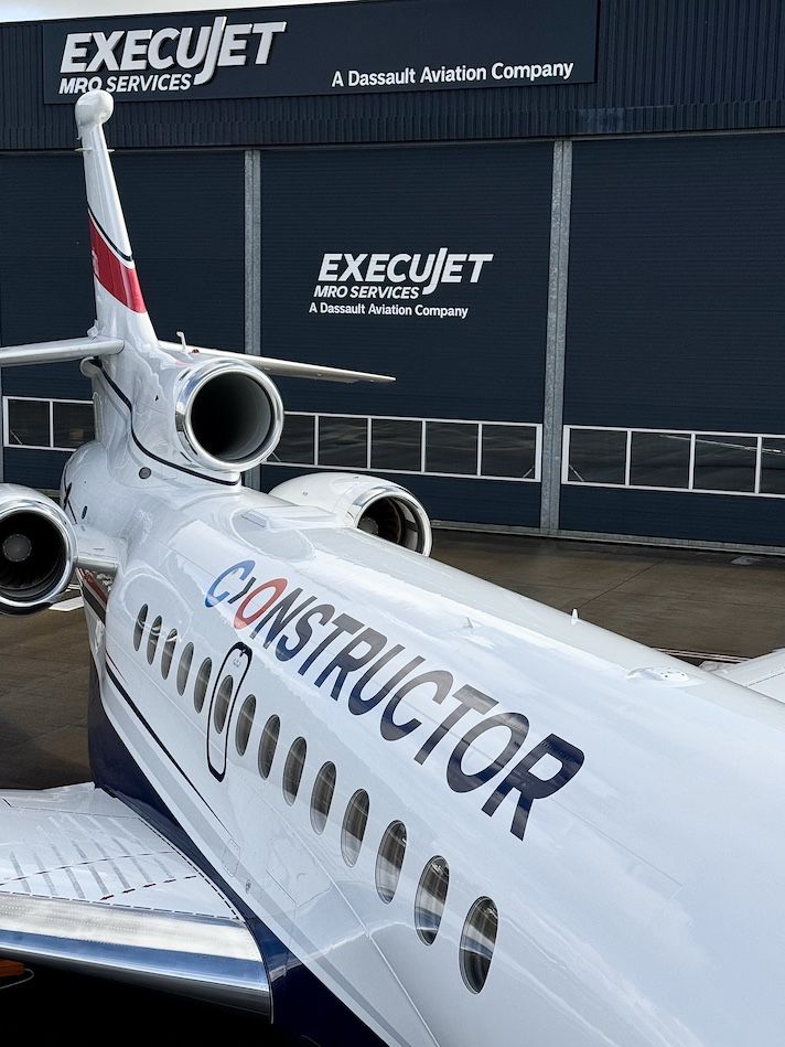 Close-up of Constructor logo on Dassault Falcon fuselage and engines