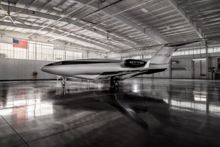 Otto Aerospace reaches regulatory milestone for Phantom 3500 Sleek silver private jet bearing Otto Aerospace logo on its fuselage and Flexjet branding on the tail, inside a large modern aircraft hangar
