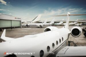 Business jets parked outside AMAC Aerospace’s facility in Basel, Switzerland
