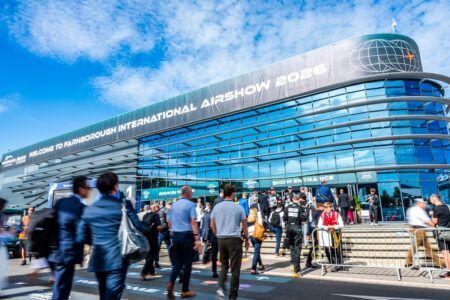 Crowds entering the Farnborough International Airshow 2026 venue beneath a large show banner