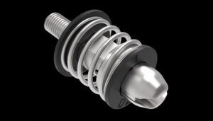 Close-up of a stainless-steel push-to-open/push-to-close pin latch with visible spring mechanism, shown against a black background