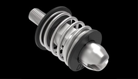 Close-up of a stainless-steel push-to-open/push-to-close pin latch with visible spring mechanism, shown against a black background