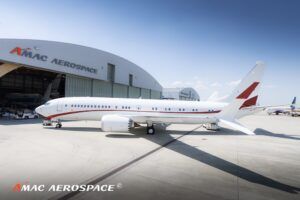 Business jet parked in front of an AMAC Aerospace hangar