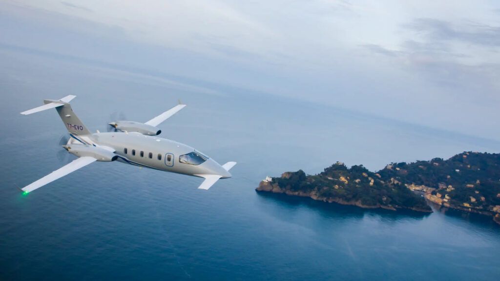 Piaggio Avanti Evo flying over water