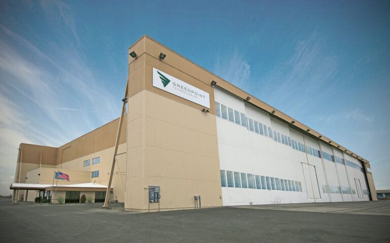 Large facility building with Greenpoint Technologies logo