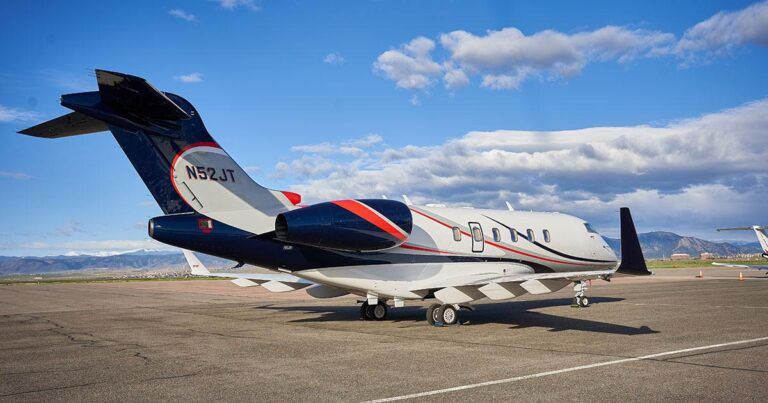 Duncan Aviation increases Gogo Galileo HDX inventory A business jet with a white, navy and red livery parked on an apron, with mountains and blue sky behind