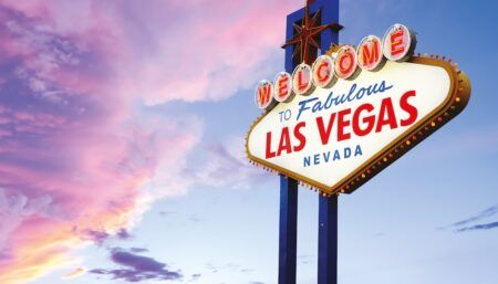FEATURE: NBAA-BACE 2026 preview The illuminated "Welcome to Fabulous Las Vegas Nevada" sign against a pink and purple sunset sky