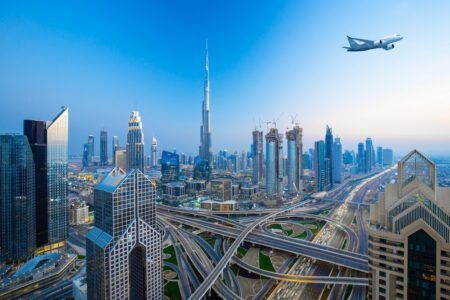 Middle East-based bizav professionals expect rise in private aircraft use An aircraft flying above the Dubai skyline at dusk